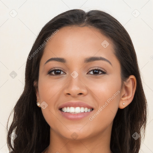 Joyful latino young-adult female with long  brown hair and brown eyes