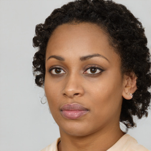 Neutral black young-adult female with medium  black hair and brown eyes