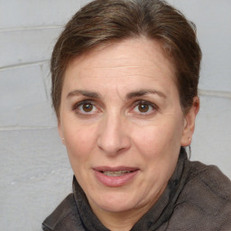 Joyful white adult female with short  brown hair and brown eyes