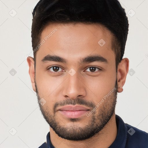 Neutral white young-adult male with short  brown hair and brown eyes