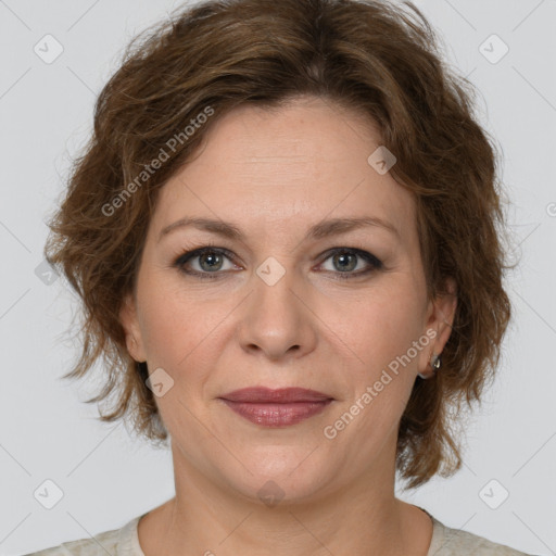 Joyful white young-adult female with medium  brown hair and green eyes