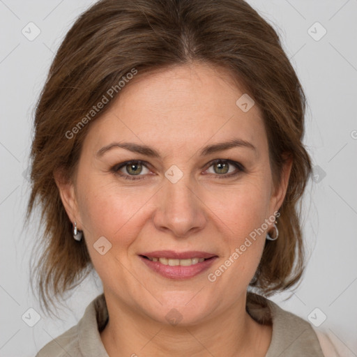 Joyful white adult female with medium  brown hair and grey eyes