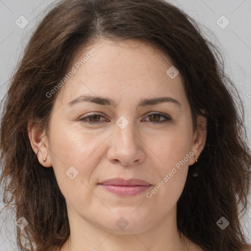 Joyful white adult female with long  brown hair and brown eyes