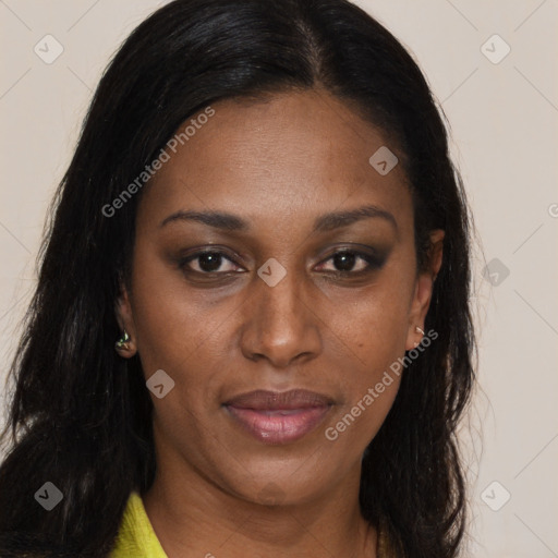 Joyful black adult female with long  brown hair and brown eyes