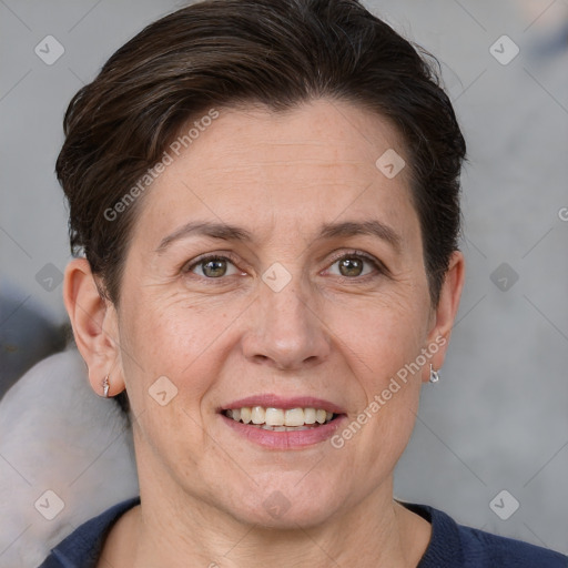 Joyful white adult female with short  brown hair and brown eyes