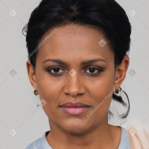 Joyful black young-adult female with short  black hair and brown eyes
