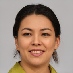 Joyful asian young-adult female with medium  brown hair and brown eyes