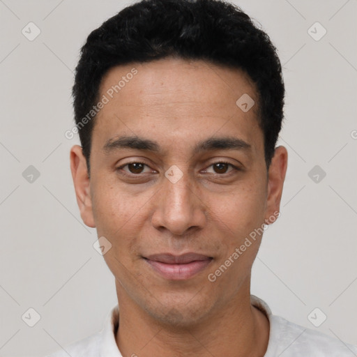 Joyful white young-adult male with short  black hair and brown eyes