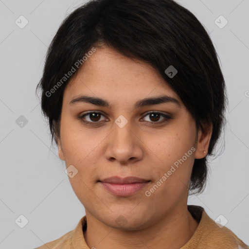 Joyful latino young-adult female with short  brown hair and brown eyes