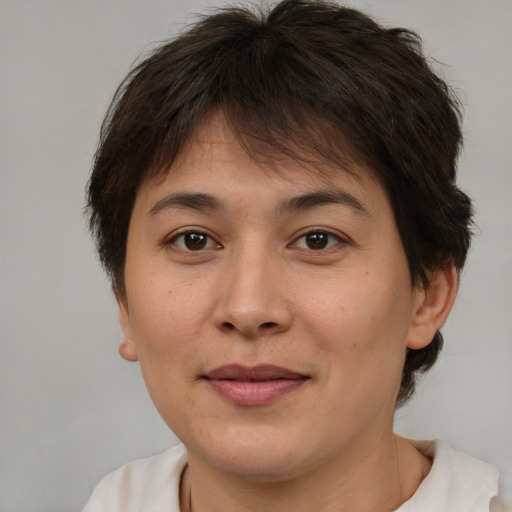Joyful white adult female with short  brown hair and brown eyes