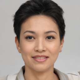 Joyful asian young-adult female with short  brown hair and brown eyes