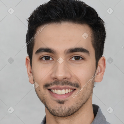 Joyful white young-adult male with short  black hair and brown eyes