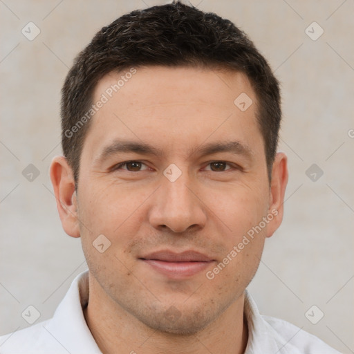 Joyful white young-adult male with short  brown hair and brown eyes