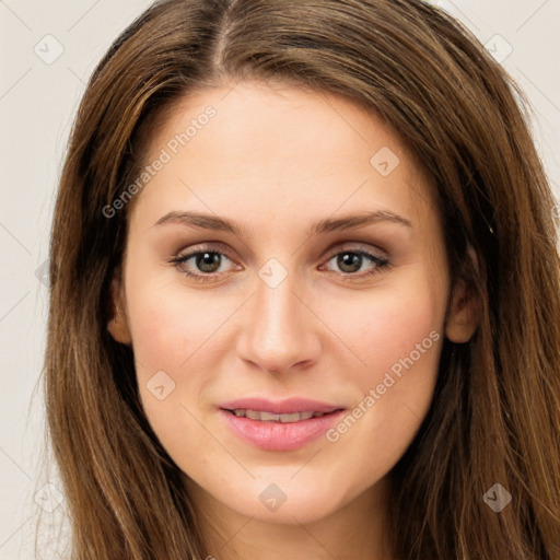 Joyful white young-adult female with long  brown hair and green eyes