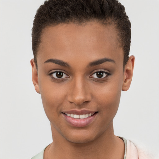 Joyful black young-adult female with short  brown hair and brown eyes