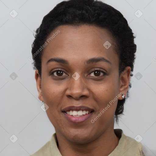 Joyful black young-adult female with short  black hair and brown eyes