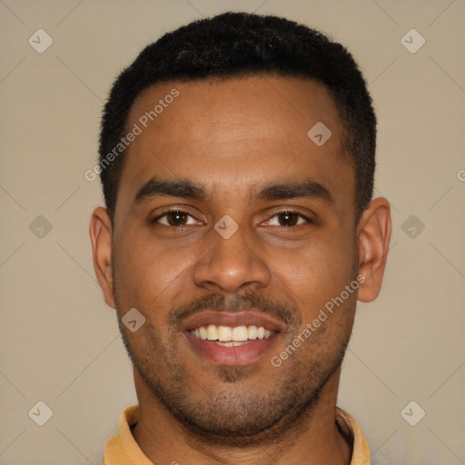 Joyful black young-adult male with short  brown hair and brown eyes