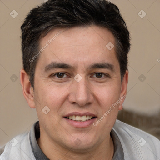 Joyful white adult male with short  brown hair and brown eyes