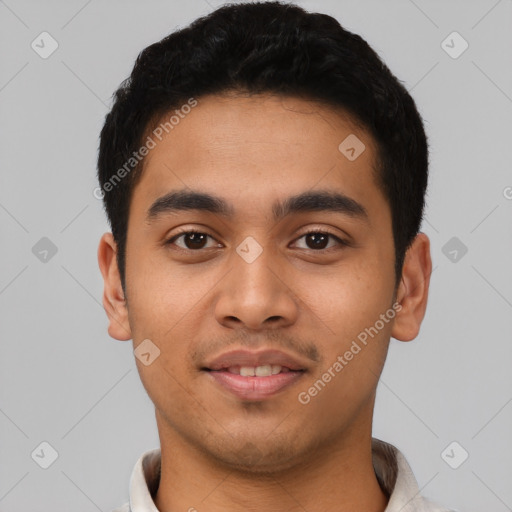 Joyful latino young-adult male with short  black hair and brown eyes