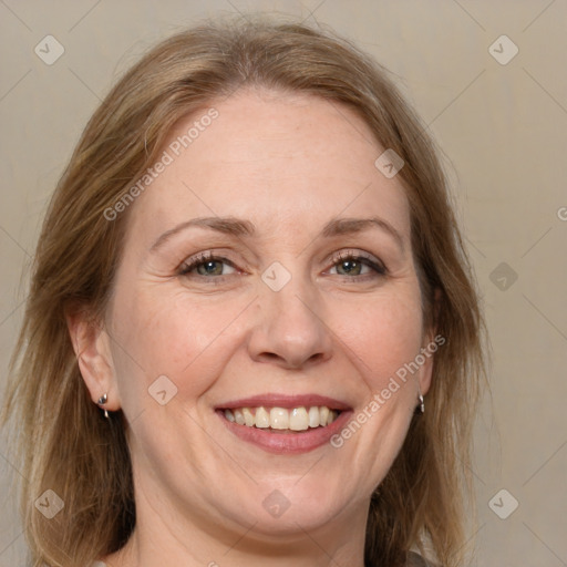 Joyful white adult female with medium  brown hair and grey eyes