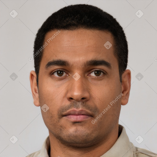 Neutral latino young-adult male with short  black hair and brown eyes