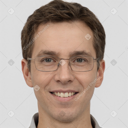 Joyful white adult male with short  brown hair and brown eyes