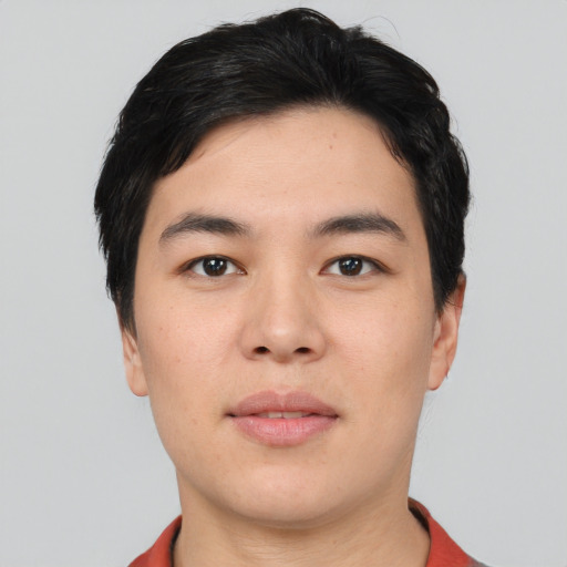 Joyful asian young-adult male with short  black hair and brown eyes
