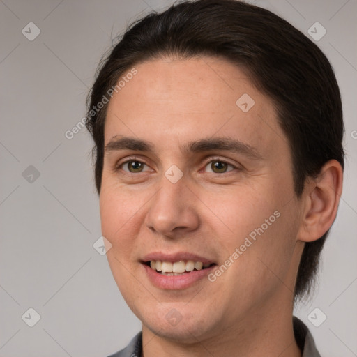 Joyful white adult male with short  brown hair and brown eyes