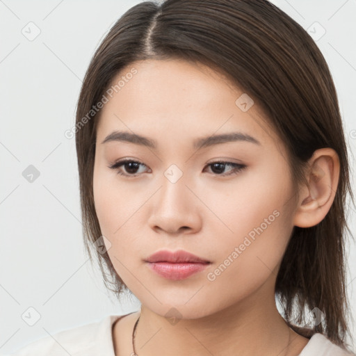 Neutral white young-adult female with long  brown hair and brown eyes