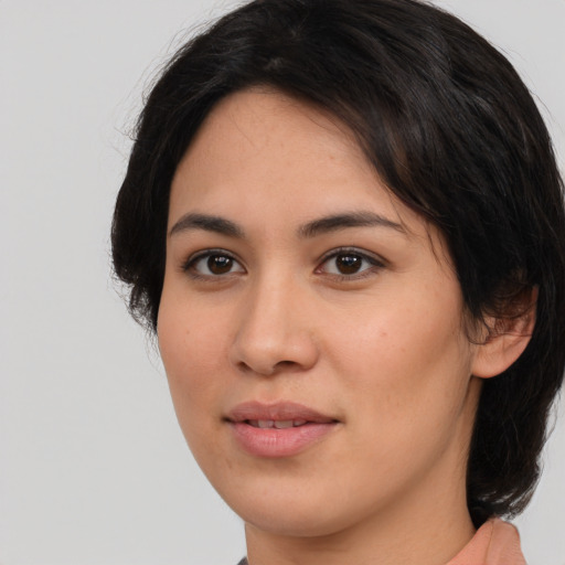 Joyful asian young-adult female with medium  brown hair and brown eyes