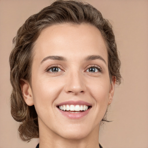 Joyful white young-adult female with medium  brown hair and green eyes