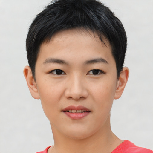 Joyful asian young-adult female with short  brown hair and brown eyes