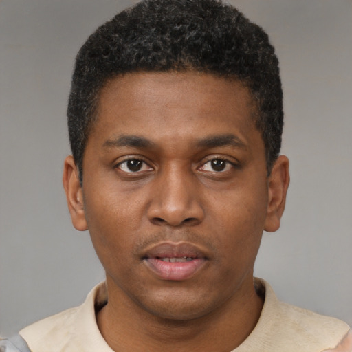 Neutral latino young-adult male with short  brown hair and brown eyes
