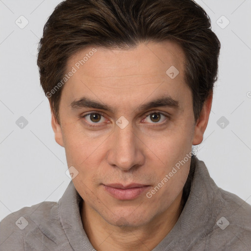 Joyful white adult male with short  brown hair and brown eyes