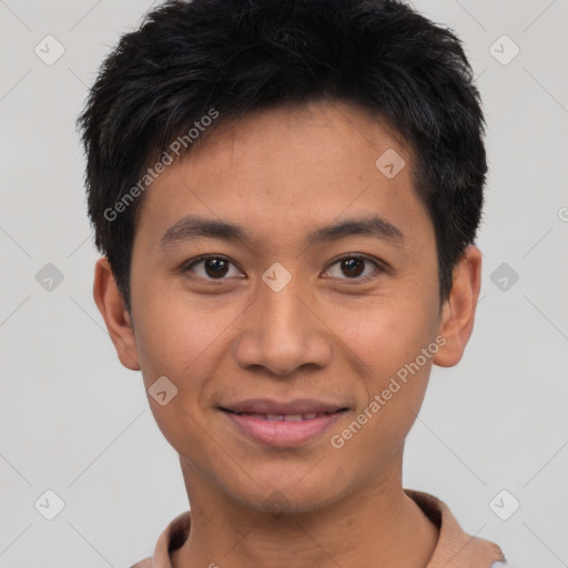 Joyful asian young-adult male with short  black hair and brown eyes