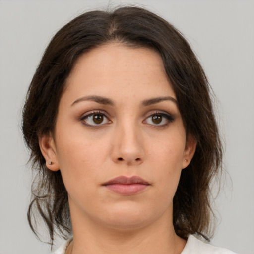 Neutral white young-adult female with medium  brown hair and brown eyes