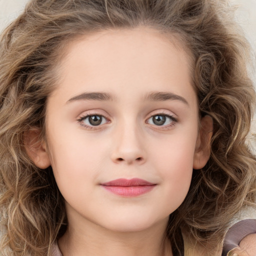 Joyful white child female with long  brown hair and brown eyes