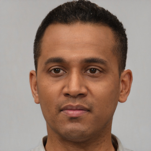 Neutral latino young-adult male with short  brown hair and brown eyes