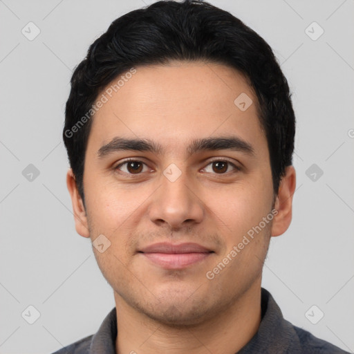 Joyful latino young-adult male with short  black hair and brown eyes