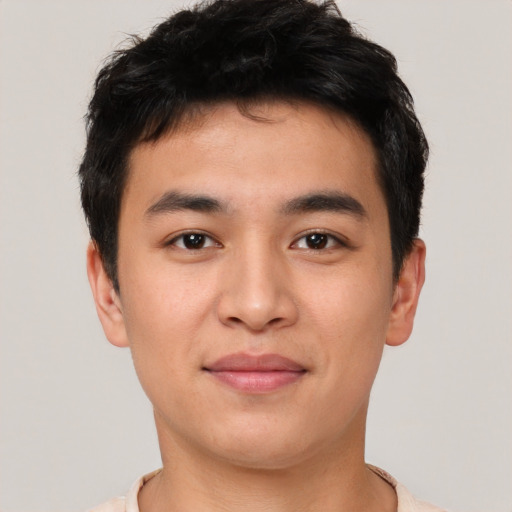 Joyful asian young-adult male with short  brown hair and brown eyes