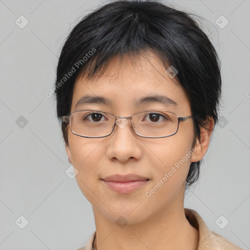 Joyful asian young-adult female with medium  black hair and brown eyes