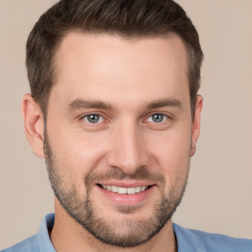 Joyful white young-adult male with short  brown hair and brown eyes