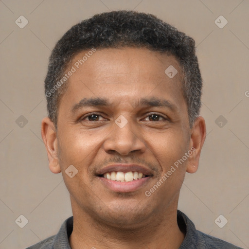 Joyful latino young-adult male with short  brown hair and brown eyes