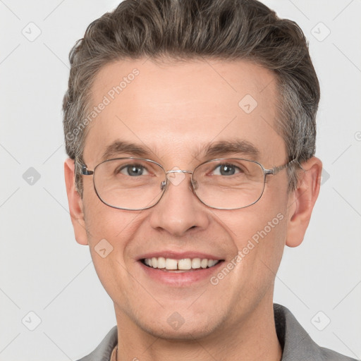 Joyful white adult male with short  brown hair and grey eyes