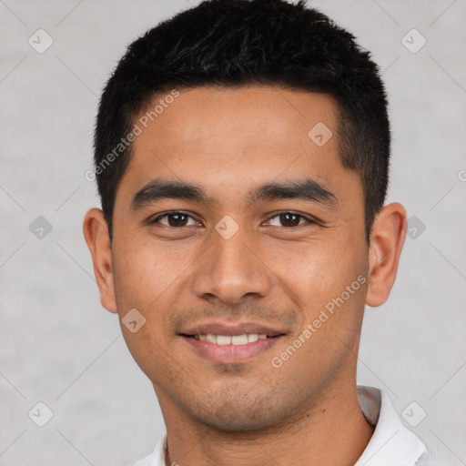 Joyful latino young-adult male with short  black hair and brown eyes