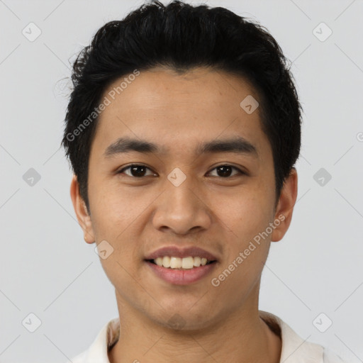 Joyful latino young-adult male with short  black hair and brown eyes