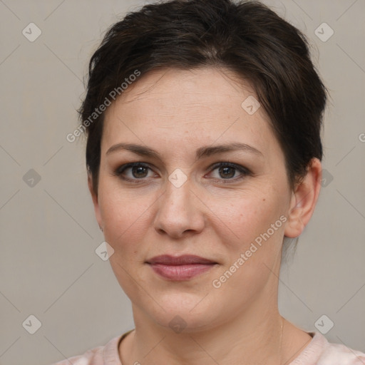 Joyful white young-adult female with short  brown hair and brown eyes