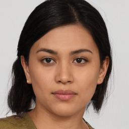 Neutral asian young-adult female with medium  brown hair and brown eyes