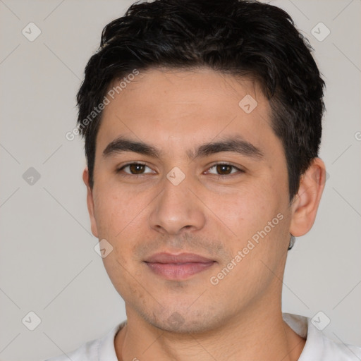 Joyful white young-adult male with short  black hair and brown eyes