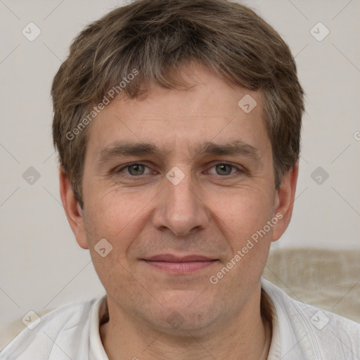 Joyful white adult male with short  brown hair and grey eyes